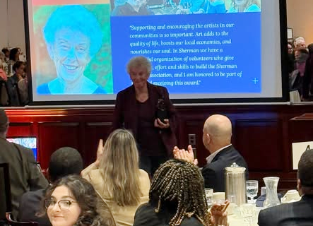 Linda Hubbard accepting the Mary Rindfleisch Heart of the Arts Award at the Cultural Alliance of Western Connecticut luncheon