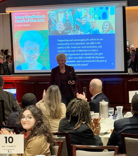 Linda Hubbard accepting the Mary Rindfleisch Heart of the Arts Award at the Cultural Alliance of Western Connecticut luncheon